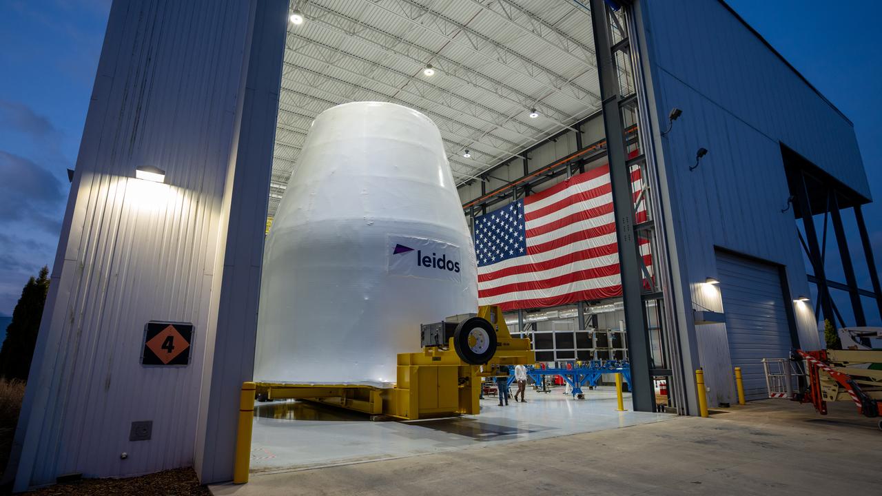  These photos and videos show how crews guided a test version of the universal stage adapter for NASA’s more powerful version of its SLS (Space Launch System) rocket to Building 4619 at the agency’s Marshall Space Flight Center in Huntsville, Alabama, Feb. 22. Built by Leidos, the lead contractor for the universal stage adapter, crews transported the hardware from a Leidos facility in Decatur, Alabama, the same day. The universal stage adapter will connect the SLS rocket’s upgraded in-space propulsion stage, called the exploration upper stage, to NASA’s Orion spacecraft as part of the evolved Block 1B configuration of the SLS rocket. It will also serve as a compartment capable of accommodating large payloads, such as modules or other exploration spacecraft. In Building 4619’s Load Test Annex High Bay at Marshall, the development test article will first undergo modal testing that will shake the hardware to validate dynamic models. Later, during ultimate load testing, force will be applied vertically and to the sides of the hardware. Unlike the flight hardware, the development test article has flaws intentionally included in its design, which will help engineers verity that the flight adapter can withstand the extreme forces it will face during launch and flight. 